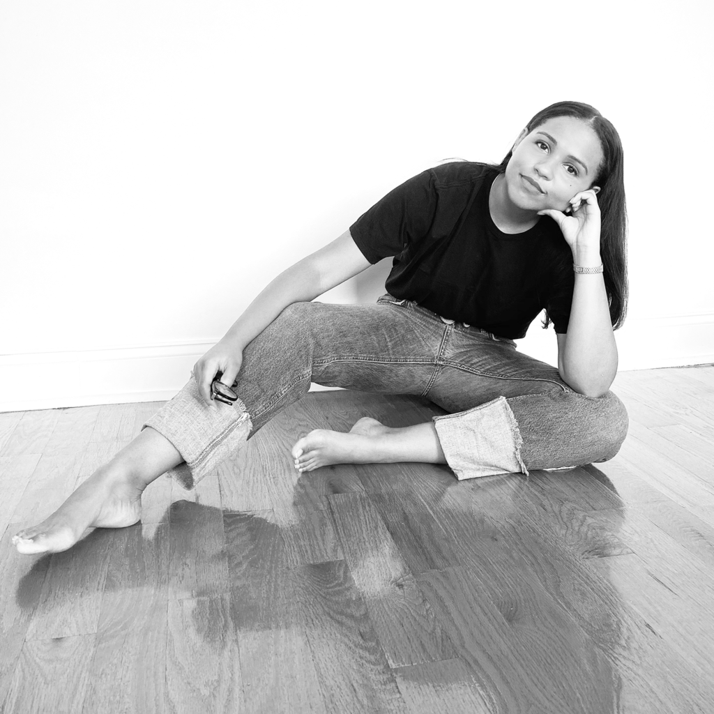 Tenlie Mourning sitting on floor in black and white